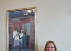 Lynne and poster in the waiting room